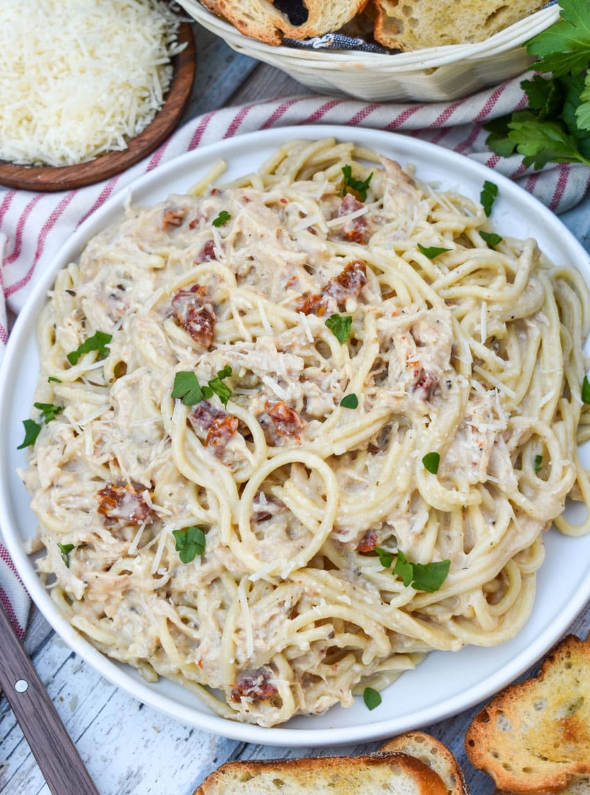 slow cooker marry me chicken on a white dinner plate