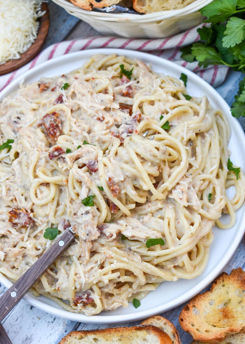 slow cooker marry me chicken on a white dinner plate