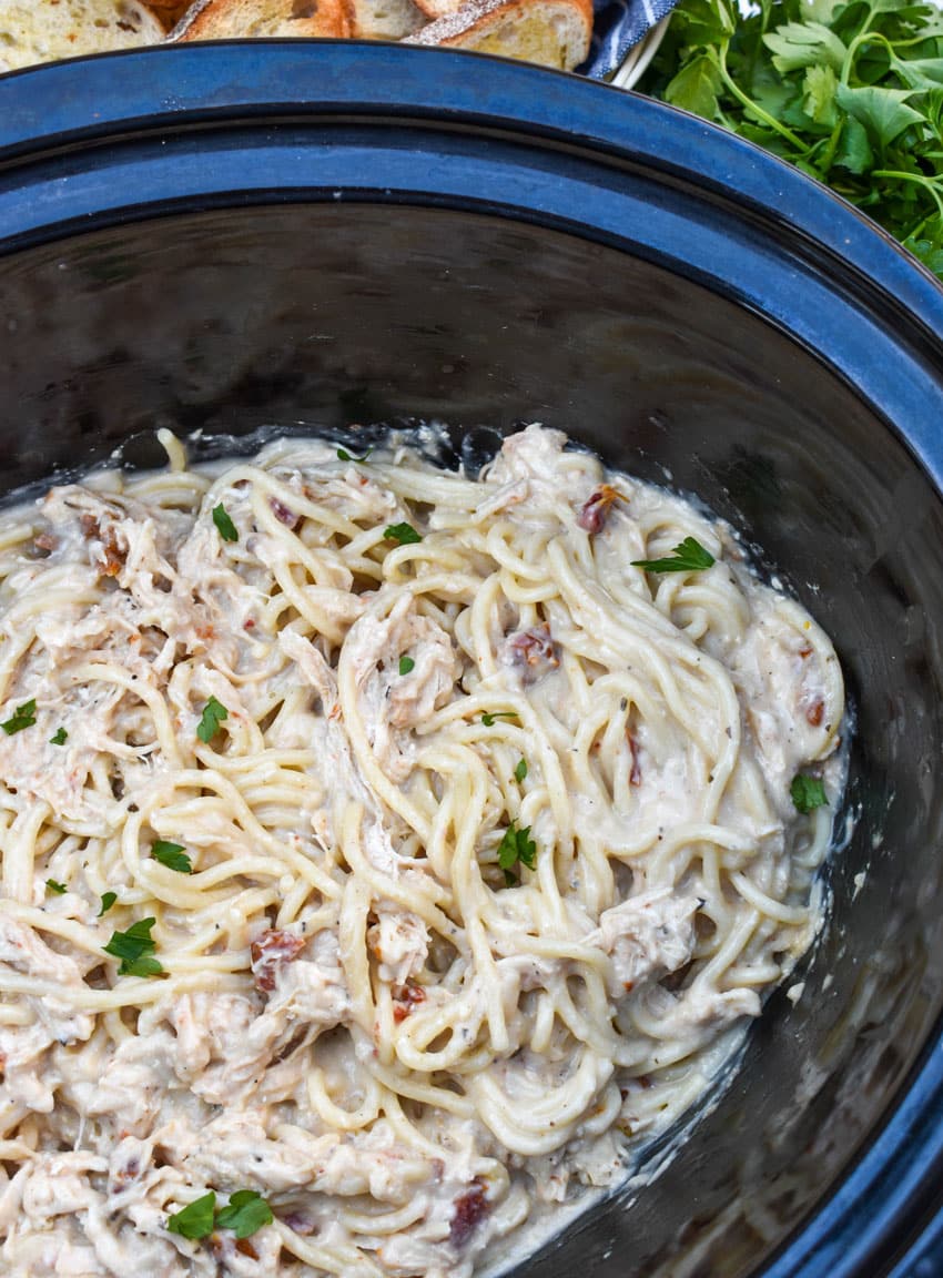 marry me chicken spaghetti in the black crock of a slow cooker