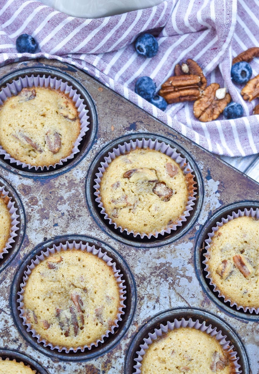 homemade pecan pie muffins in a metal muffin tin