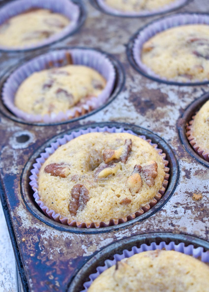 homemade pecan pie muffins in a metal muffin tin