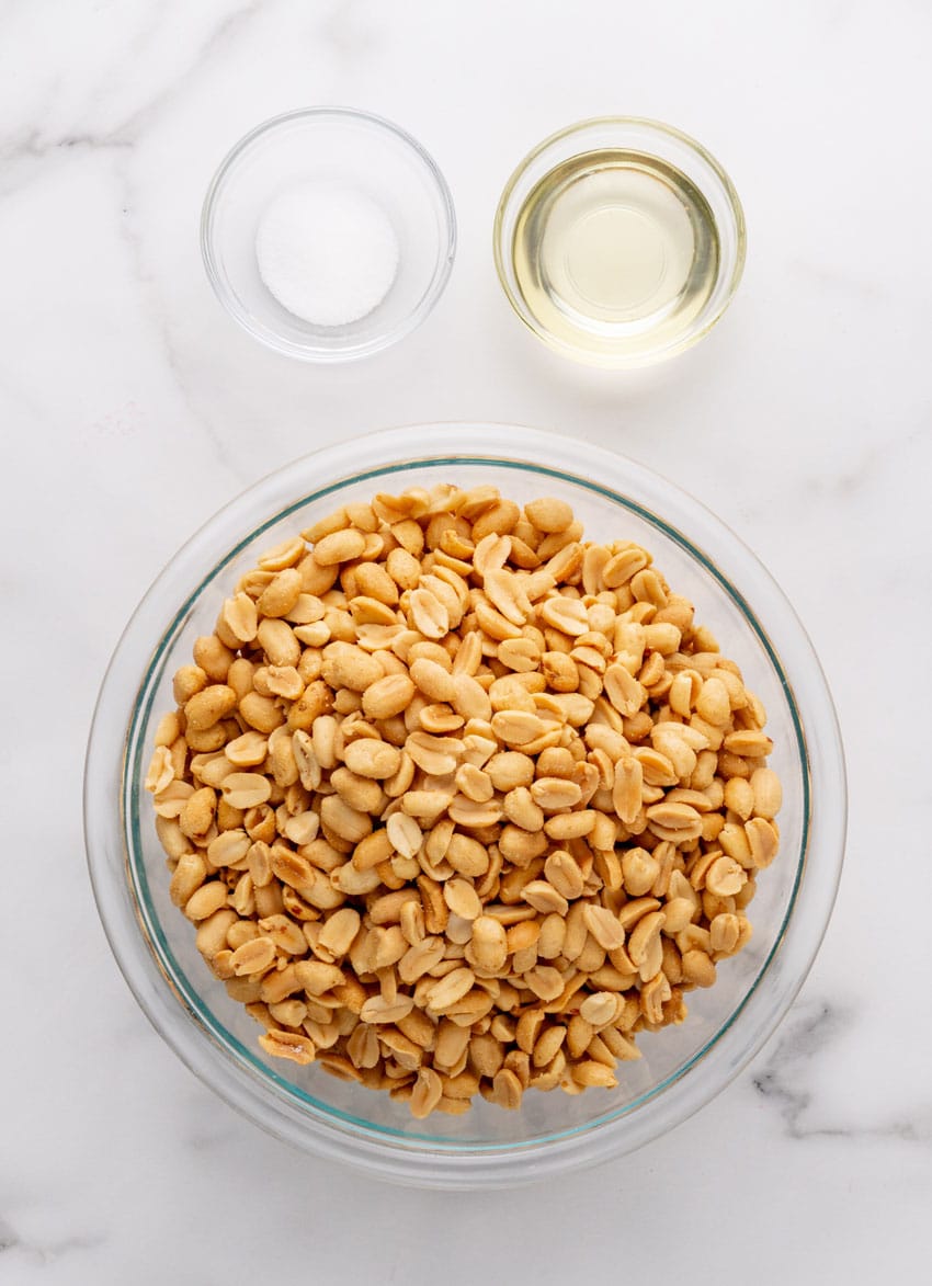 an overhead image showing the measured ingredients needed to make a batch of homemade creamy peanut butter