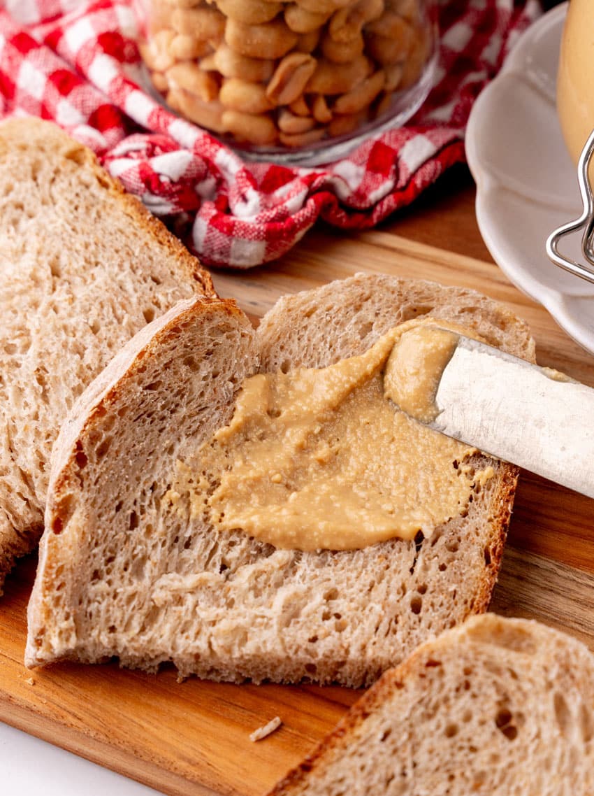 homemade peanut butter spread on soft wheat sandwich bread