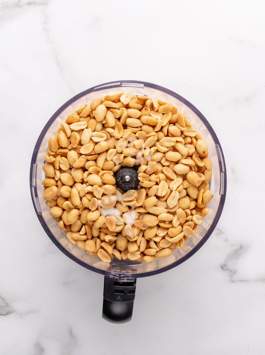 peanuts in a food processor fitted with the blade attachment