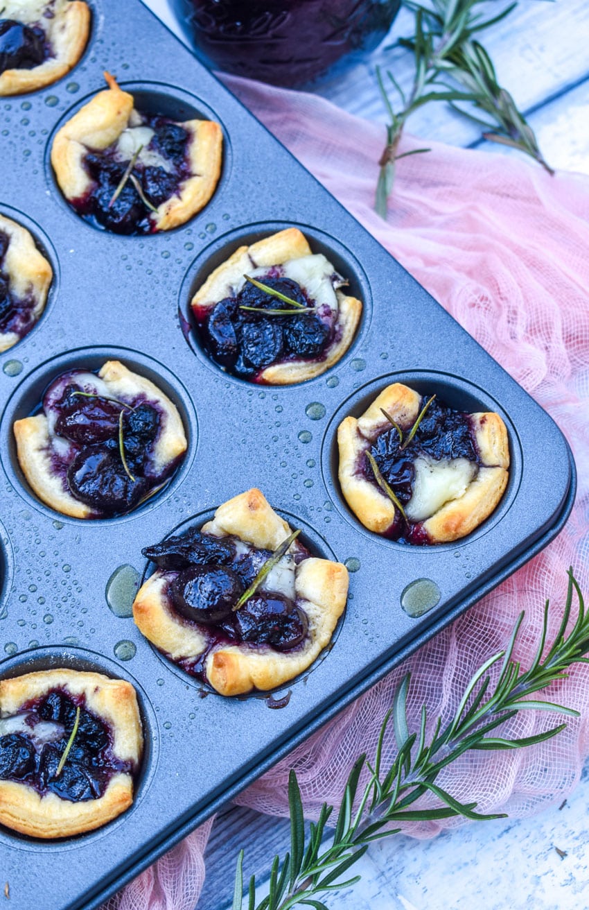 cranberry brie bites in a mini muffin tin pan