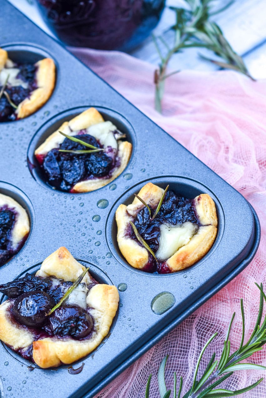 cranberry brie bites in a mini muffin tin pan