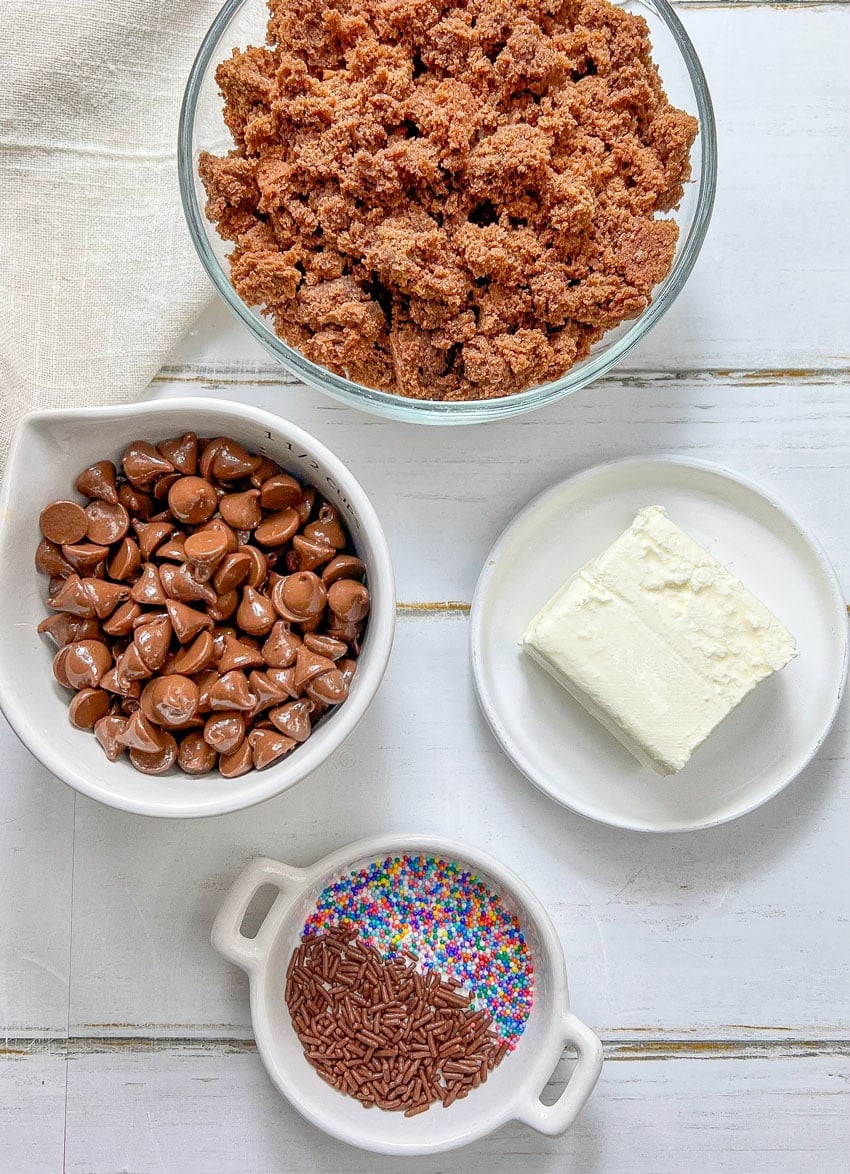 an overhead image showing the measured ingredients needed to make a batch of homemade brownie cheesecake truffles