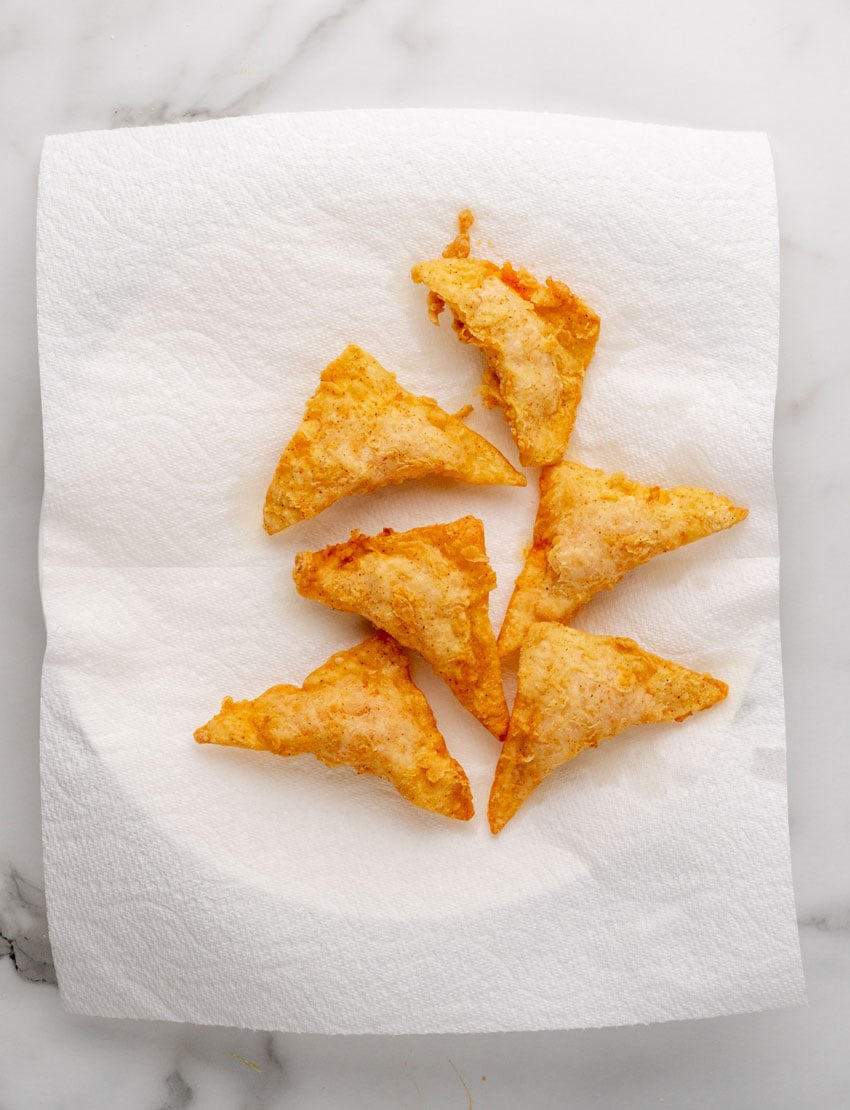 homemade fried cheesecake factory buffalo blasts draining on a paper towel lined plate
