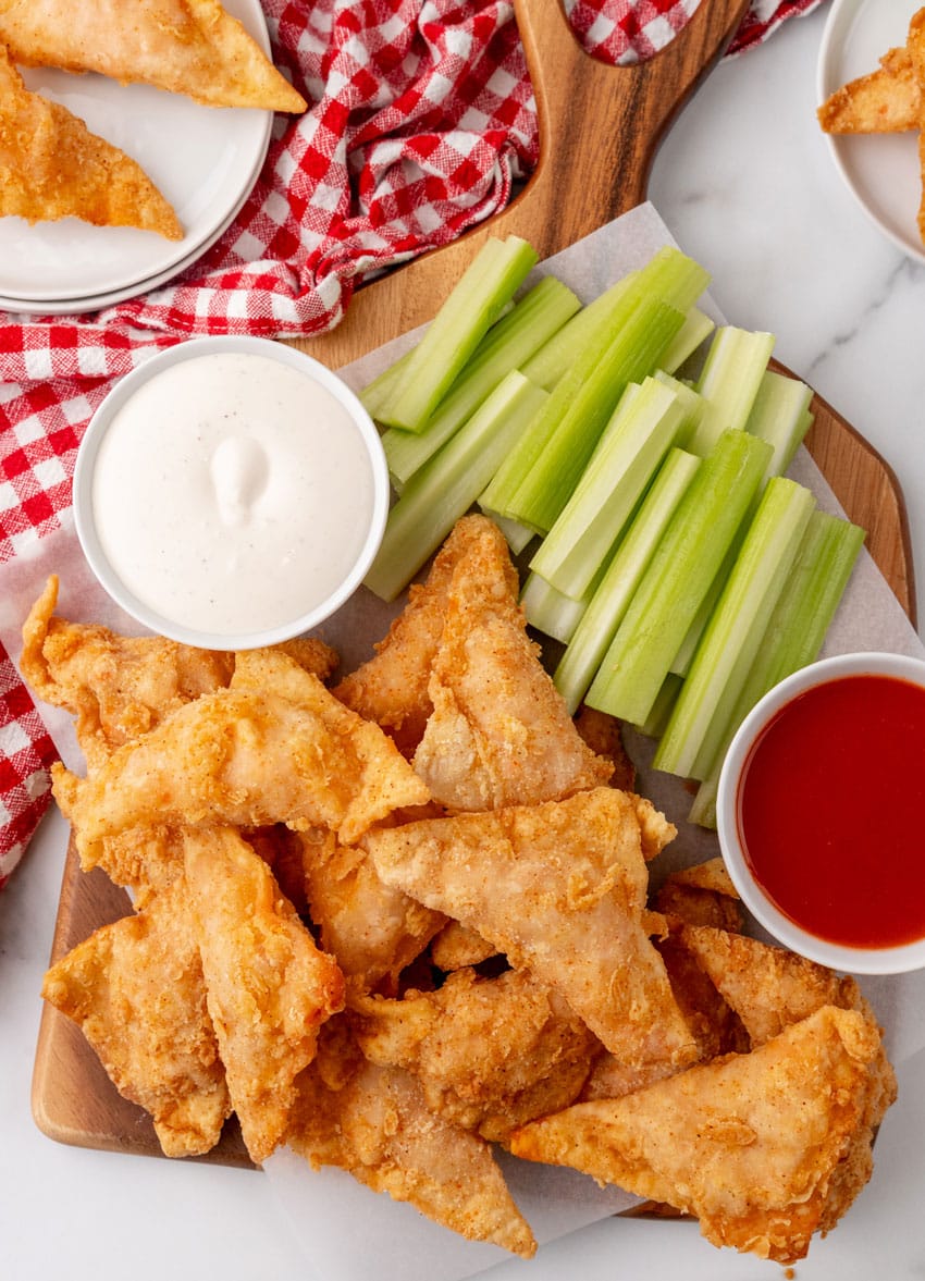copycat cheesecake factory buffalo blasts on a wooden serving tray