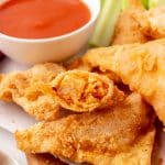 copycat cheesecake factory buffalo blasts on a wooden serving tray
