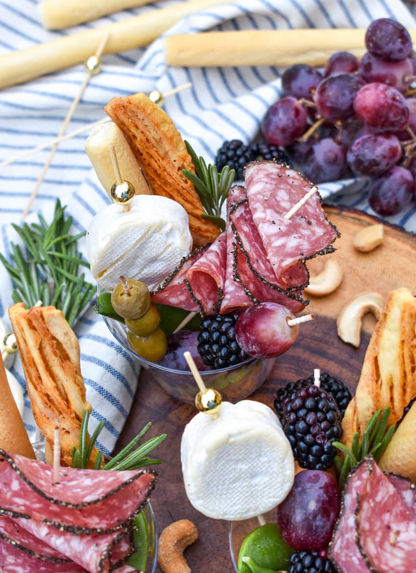 homemade charcuterie cups on a wooden serving board