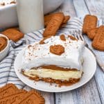 a slice of cookie butter delight layered dessert on a small white plate