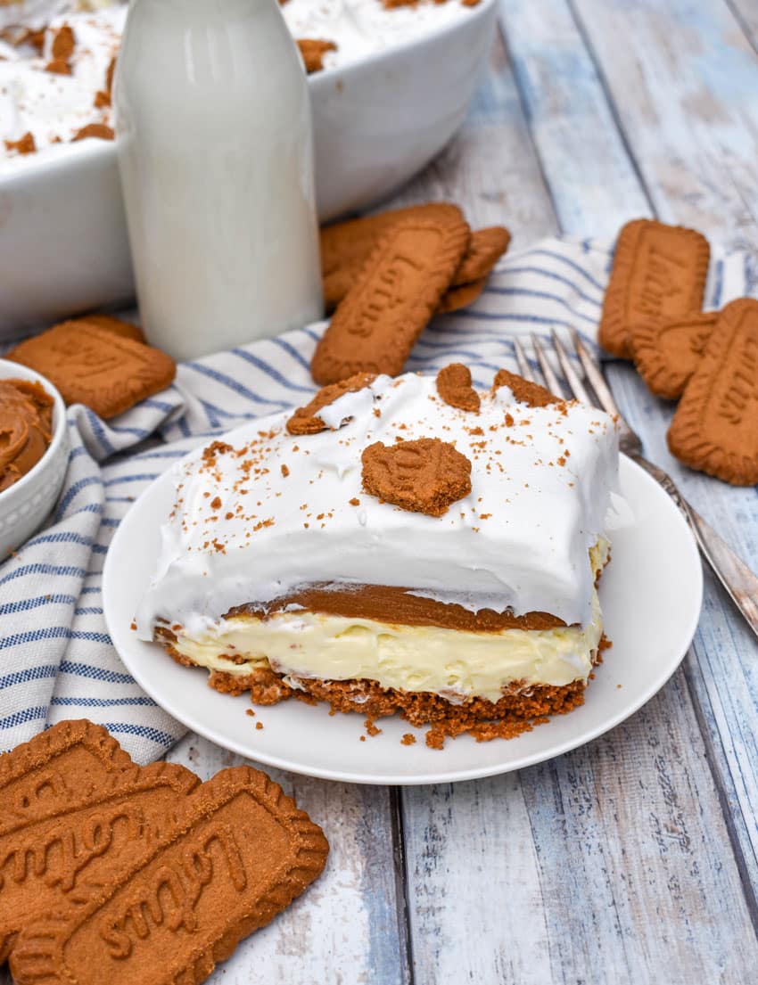 a slice of cookie butter delight layered dessert on a small white plate