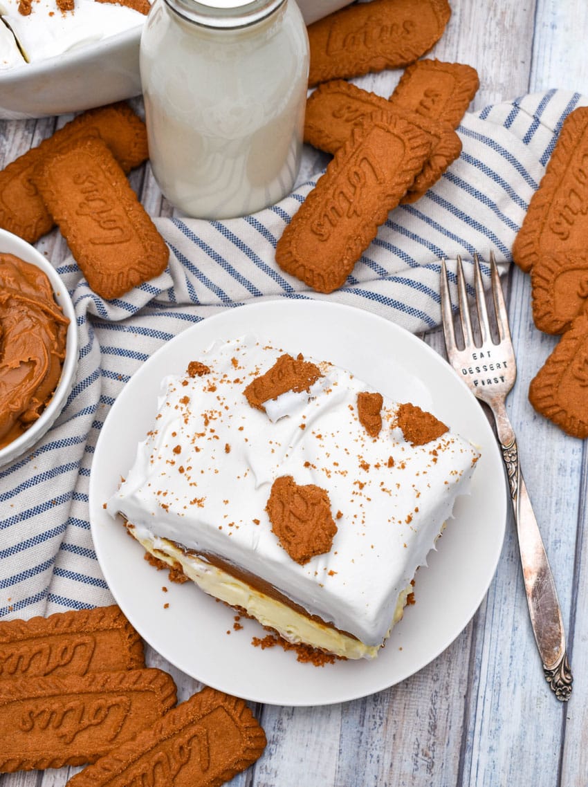 a slice of cookie butter delight layered dessert on a small white plate