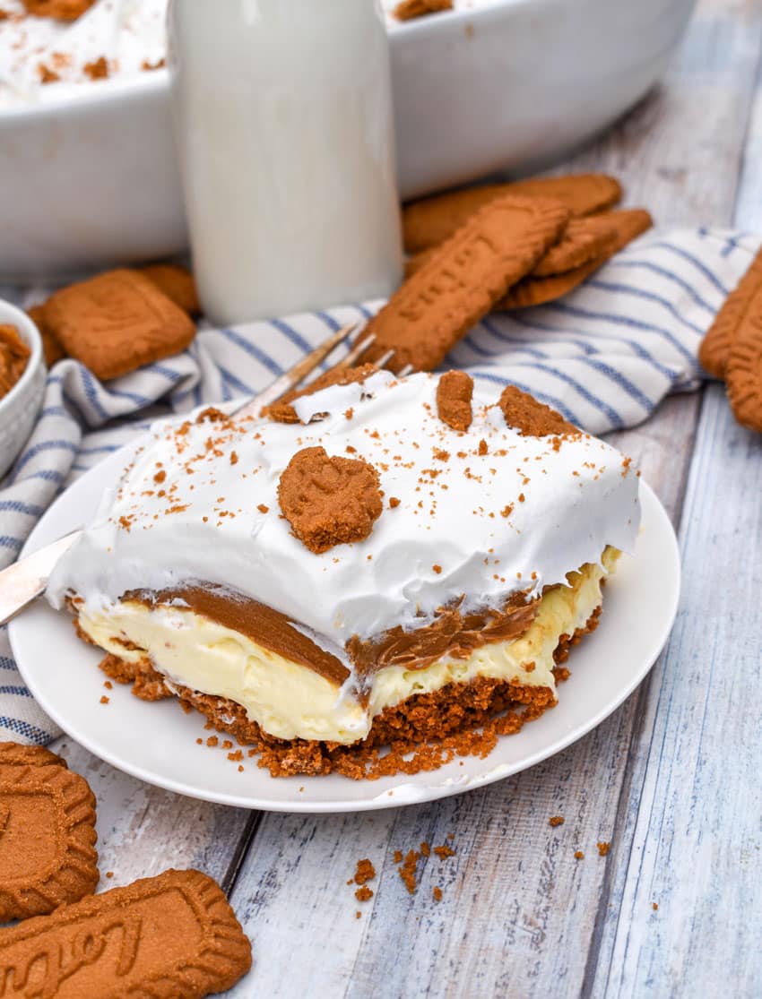 a slice of cookie butter delight layered dessert on a small white plate