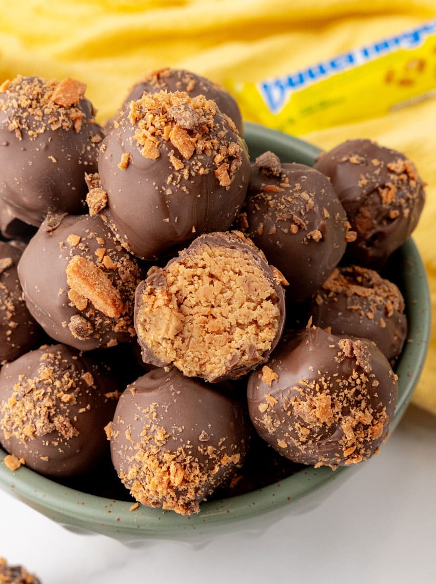 butterfinger truffles piled in a green bowl