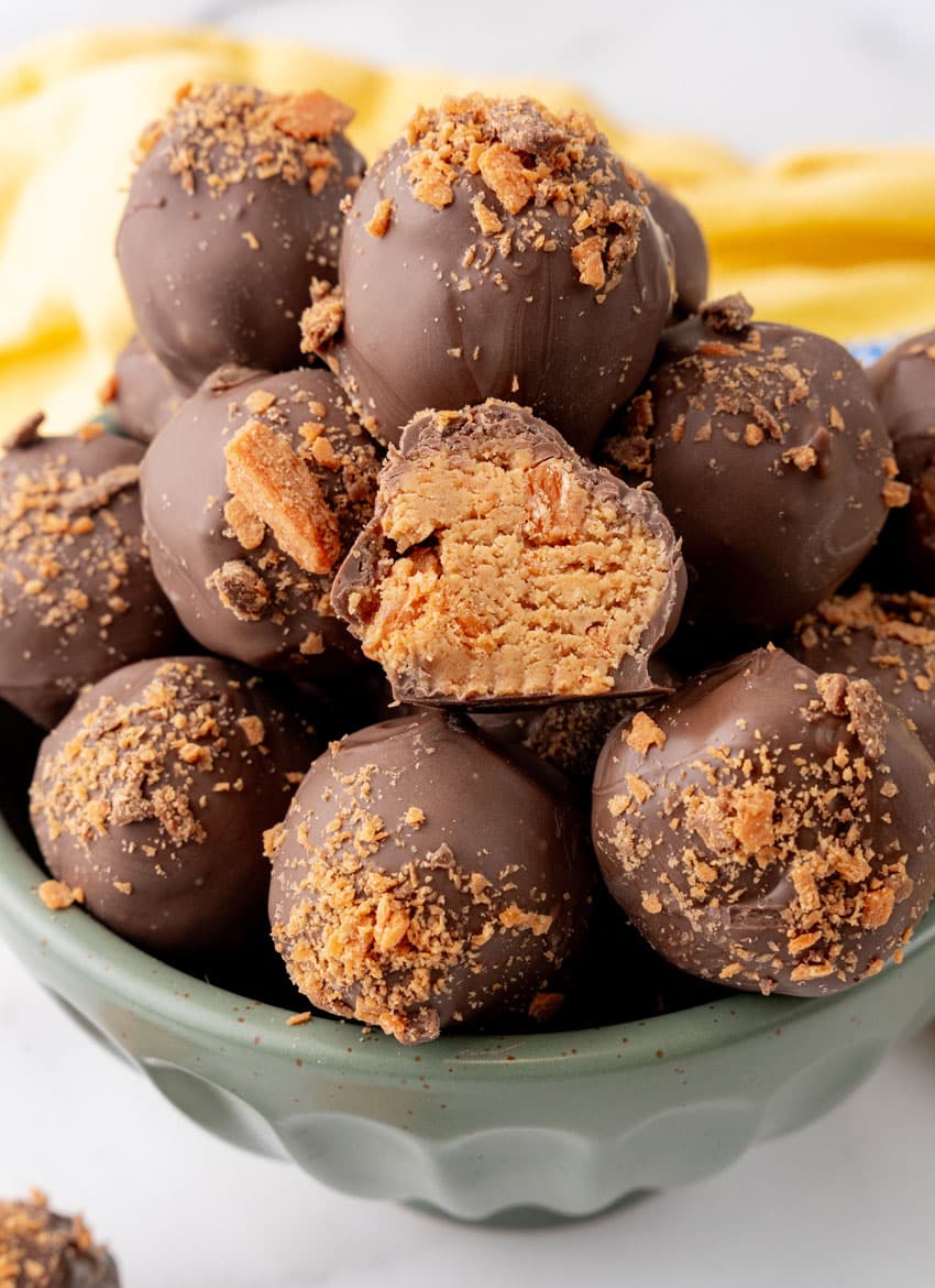 butterfinger truffles piled in a green bowl