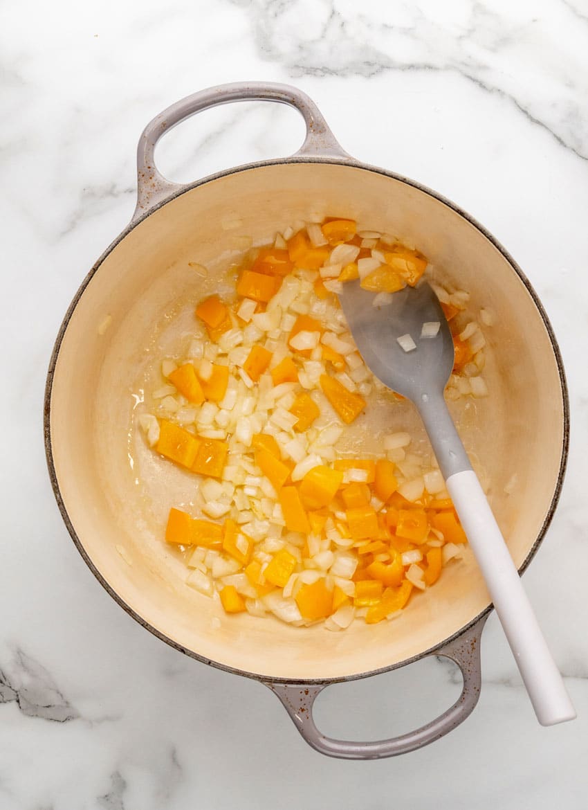 vegetables sauteeing in a large dutch oven